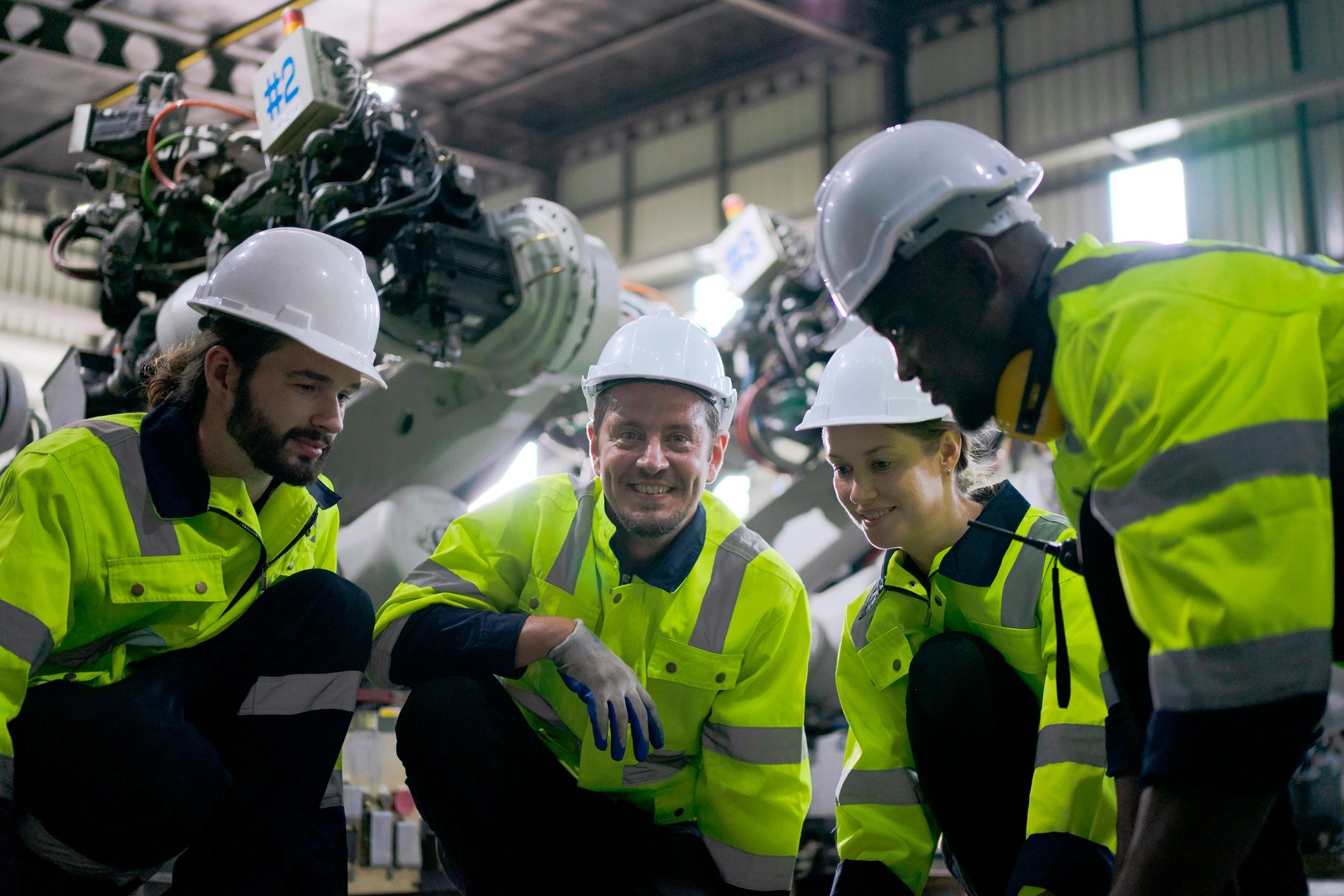 Engineer working with robotic arm