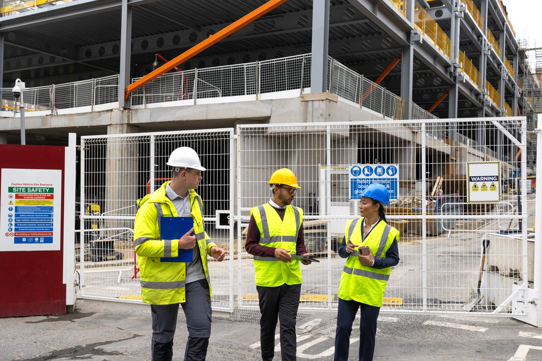 Construction professionals reviewing plans on site